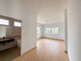 Spacious and bright living room with an open kitchen design