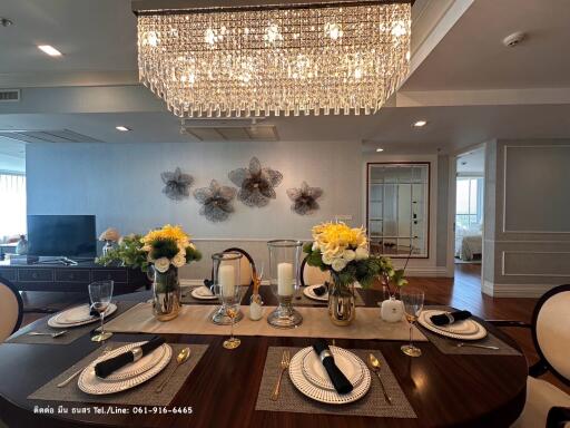 Elegant dining room with modern lighting and decor