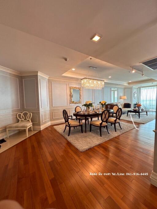 Elegant living room with dining area and hardwood flooring