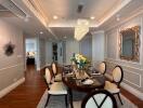 Elegant dining room with a wooden round table and upholstered chairs