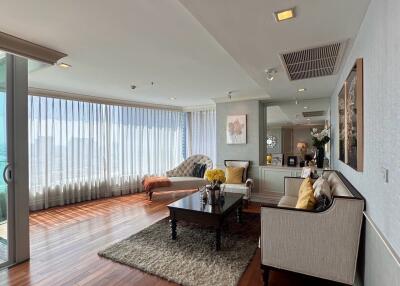 Spacious living room with abundant natural light and modern furnishings
