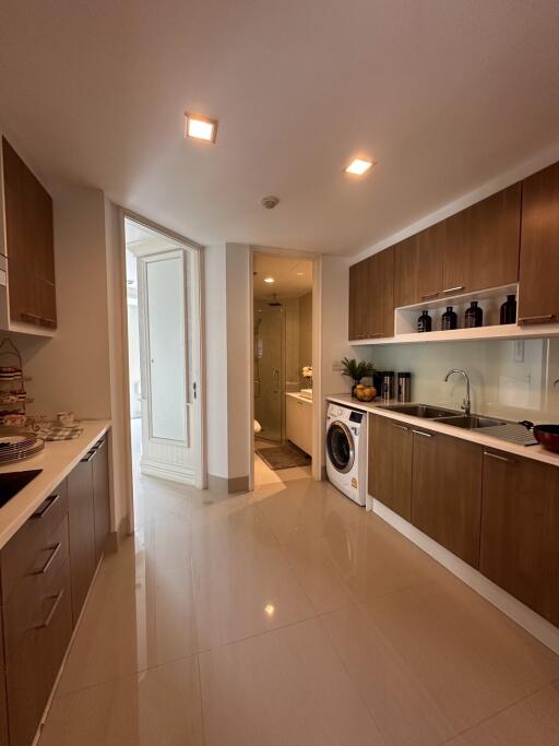 Modern kitchen with wooden cabinets and built-in appliances