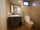 Modern bathroom with neat finishes and ample lighting