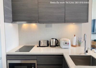 Modern kitchen with stainless steel appliances and wooden cabinets