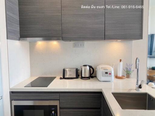 Modern kitchen with stainless steel appliances and wooden cabinets