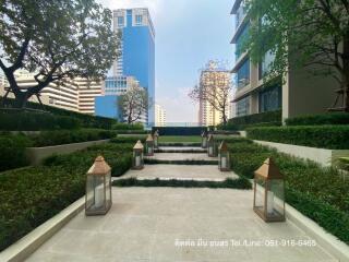 Modern building complex exterior with landscaped walkway