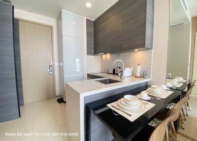 Modern kitchen with integrated appliances and dining area