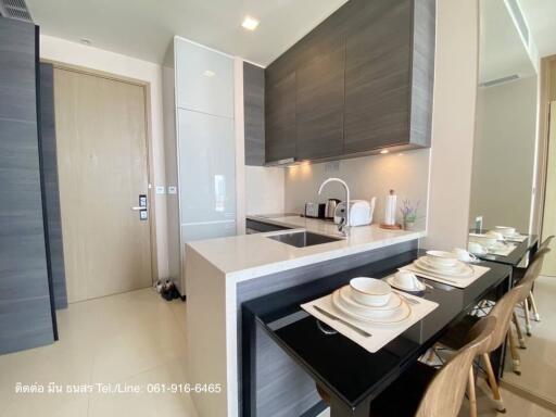 Modern kitchen with integrated appliances and dining area