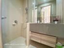 Modern bathroom interior with glass shower and vanity