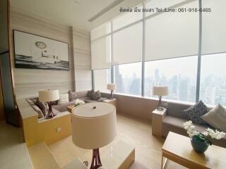 Modern living room with large windows and city view