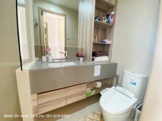 Modern bathroom with large mirror and under-sink storage