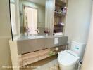 Modern bathroom with large mirror and under-sink storage