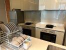 Modern kitchen with stainless steel appliances and white cabinetry