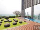 Modern rooftop garden with city view, wooden decking, and outdoor furniture