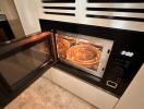 Modern built-in kitchen oven with open door