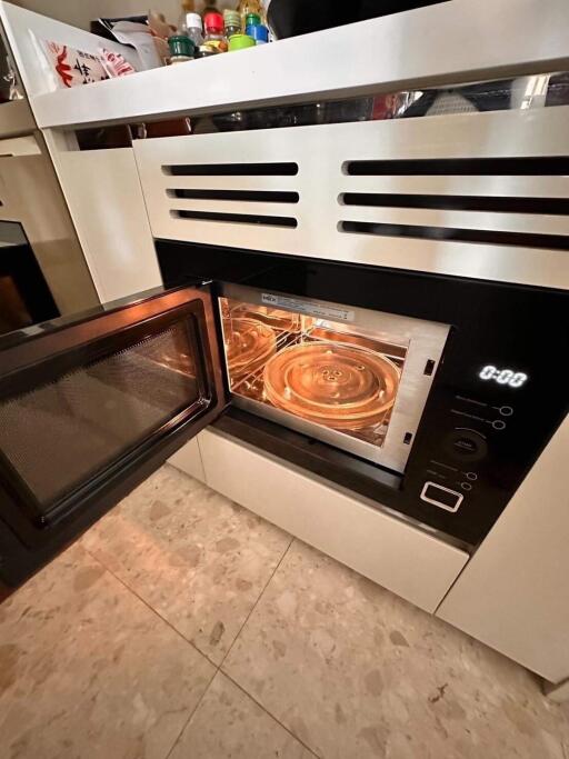 Modern built-in kitchen oven with open door
