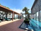 Modern rooftop pool with city view and lounge area