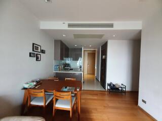 Modern dining room with an open concept layout leading to the kitchen