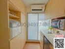 Compact modern kitchen with built-in appliances and ample cabinet space