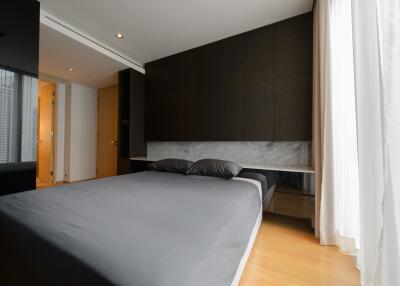 Modern bedroom with a large bed and minimalist design