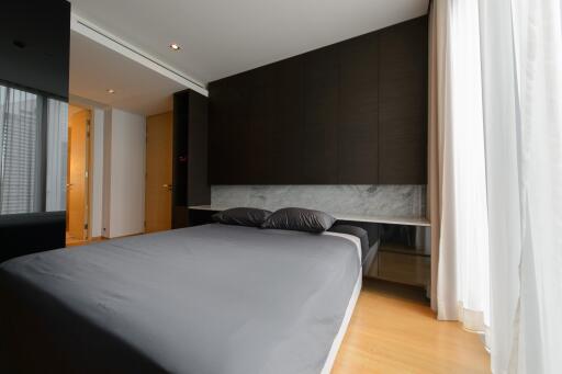 Modern bedroom with a large bed and minimalist design
