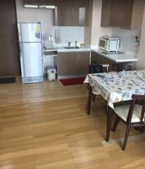 Spacious kitchen with modern appliances and dining area