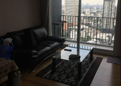 Spacious living room with city view and hardwood floors