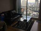 Spacious living room with city view and hardwood floors