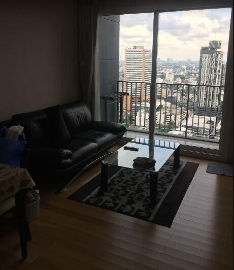 Spacious living room with city view and hardwood floors