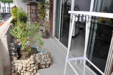 Spacious balcony with garden and seating area