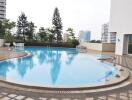 Outdoor swimming pool with city skyline