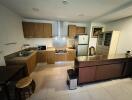 Modern kitchen with wooden cabinets and stainless steel appliances