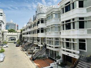 Elegant residential building facade with balconies and architectural details