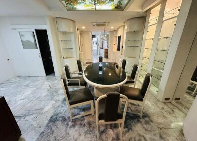 Elegant dining room with glass table and modern chairs