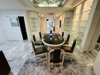 Elegant dining room with glass table and modern chairs