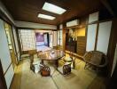 Spacious traditional Japanese living room with tatami floors and shoji screens