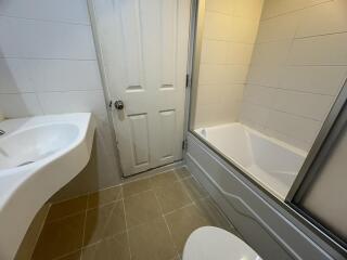 Clean and modern bathroom with bathtub and sink