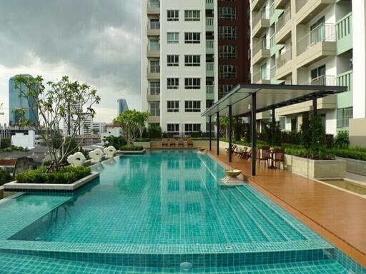 Residential building with outdoor swimming pool and lounge area