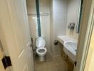 Modern bathroom interior with white fixtures