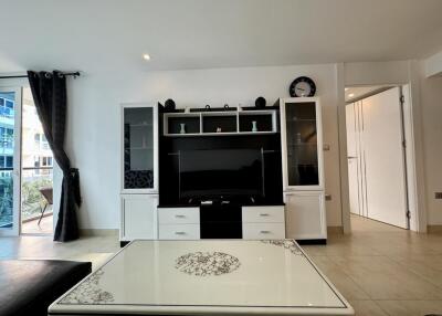 Spacious living room with modern entertainment unit and natural light