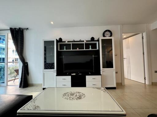 Spacious living room with modern entertainment unit and natural light