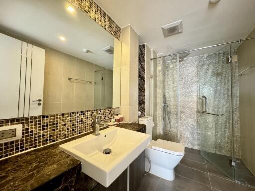 Modern bathroom with shower and elegant finishes