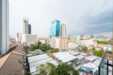 Panoramic city view from a high-rise apartment balcony