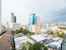 Panoramic city view from a high-rise apartment balcony