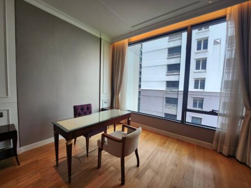 Modern dining room with large window and city view