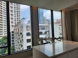 City view from a high-rise apartment with large windows