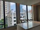 City view from a high-rise apartment with large windows