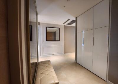 Spacious modern hallway with built-in storage and elegant trim