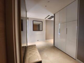 Spacious modern hallway with built-in storage and elegant trim