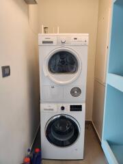Stacked washer and dryer in a compact laundry room
